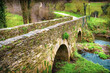 The Medieval Roman Bridge Puente Romano outside the Town of Sarria in Galicia, on the Way of St James Pilgrimage Trail Camino de Santiago
