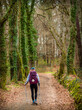 © Max Maximov - Pilgrim Girl Hiking in the Spring Forest in Galicia along the Way of St James Camino de Santiago