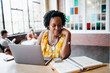 © Creative Flame - African American woman working at a local cafe