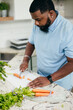 © Creative Flame - Black man in kitchen preparing healthy meal