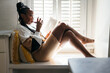 © Creative Flame - Self Care - black woman relaxing, reading book, and drinking wine