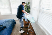 Black Man Ironing Clothes, Everyday Life, Disabled