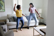 © Creative Flame - Black mom teaches daughter dance at home