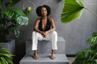 © Creative Flame - Elegant young woman sitting on steps among plants