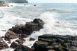 © Allison - Black rocks being hit by waves