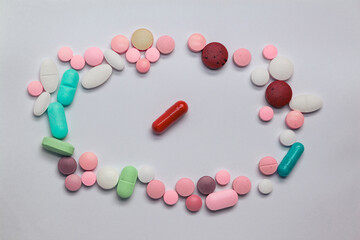 Wall Mural - Colored pills or drugs on a neutral background. Medicines for legal use.