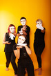 © Marina Chernivetskay - girls in white masks and white gloves in the image of mimes an unseen wall show hands actors of theater and cinema, the concept of advertising a shopping center