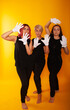 © Marina Chernivetskay - girls in white masks and white gloves in the image of mimes an unseen wall show hands actors of theater and cinema, the concept of advertising a shopping center