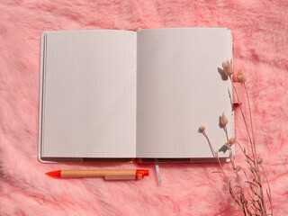Wall Mural - Blank notebook mockup on pink fur flat lay Coral fluffy feminine fabric top view Female blog notepad Sketchbook template