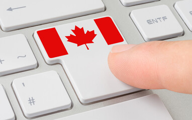 Wall Mural - a keyboard with a labeled button - flag of canada