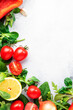 Healthy food background with various green herbs and vred vegetables. Ingredients for cooking salad. Top view, copy space