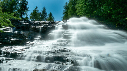 france Waterfall with long exposure and blurred water flow in Ecrins national park
