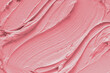 Pink cream texture. Protection and nutrition of the body skin. Macro. 