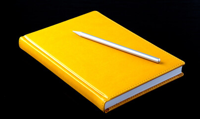 Poster - Yellow notebook with pen on the black background