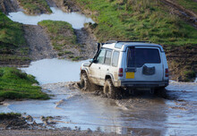 4x4 Land Rover Discovery Series II Off Roading, Wading In Deep Water And Slippery Mud