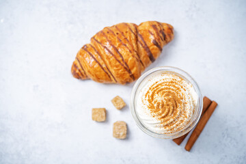 Wall Mural - Pumpkin spiced Latte Coffee with whipped cream in a glass