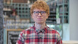 Portrait of Upset Young Redhead Young Man Feeling Sad at Camera