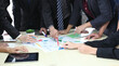 © sittinan - Business People Analyzing Statistics Financial Concept or Business People Meeting Conference Discussion Corporate Concept or Teamwork with business people analysis cost graph on desk at meeting room.