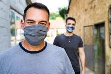 Portrait Of Adult Caucasian Man Wearing Protective Mask Due To Coronavirus Delta Variant Outbreak - Modern Mature Male Social Distance Virus Prevention Front View In Day Outdoor The New Normal Concept