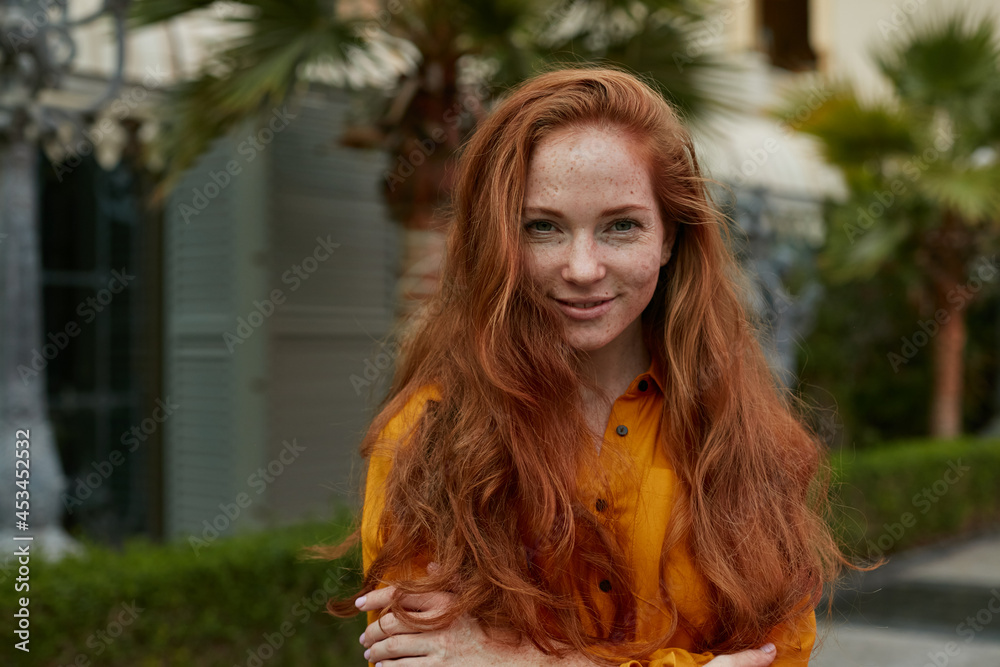 Young beautiful woman with long red hair outdoors portrait. Stock Photo ...