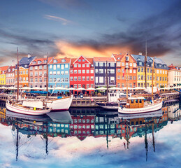 Wall Mural - breathtaking beautiful scenery with boats in the famous nyhavn in copenhagen, denmark at sunrise. ex