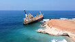 Abandoned ship Edro III near Cyprus beach. Rusty ship ran aground near the shore. High quality photo