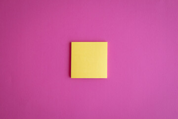 Sticker - Top view of a yellow blank paper on a pink background with a copy space