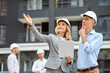 © zinkevych - Inspector and an engineer in hardhats staring into the distance