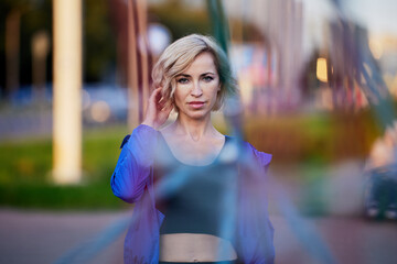 Wall Mural - Graceful woman stands on playground after exercises.