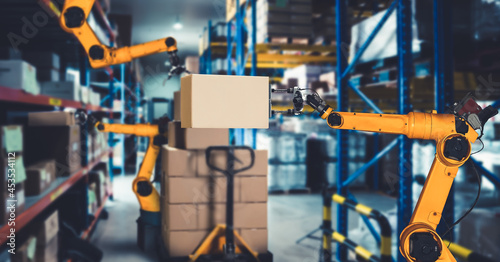 Smart robot arm system for innovative warehouse and factory digital technology . Automation manufacturing robot controlled by industry engineering using IOT software connected to internet network .