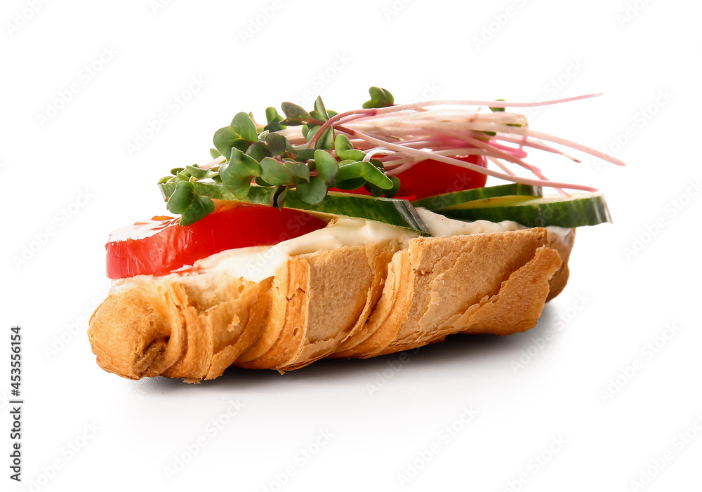 Tasty croissant with vegetables and micro green on white background