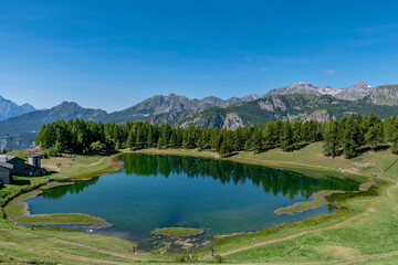 Wall Mural - Panoramic view of the Lake of Lod, Chamois, Valtournenche, Aosta valley, Italy, in the summer season