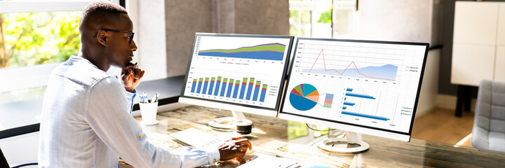 Poster - African American Business Desktop Looking At Graphs