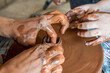 © Aleksandr Bushkov - Master class in pottery at the festival of folk crafts. A potter teaches a child how to make pottery.