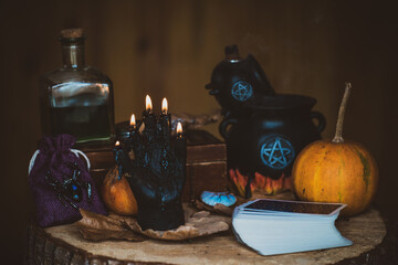 Candle burns on the altar, magic among candles, clean energy, magical concept, autumn time	