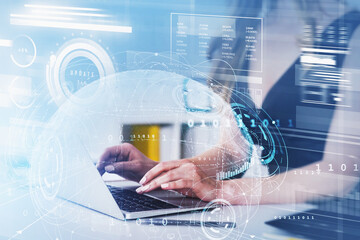 Poster - Businesswoman in black dress is typing on laptop