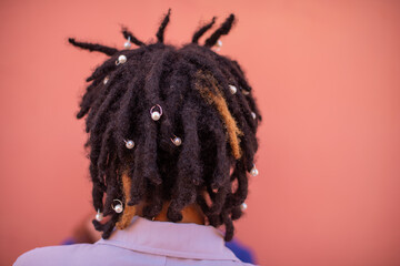 Rear view of person with dreadlocks