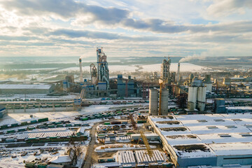 Sticker - Aerial view of cement plant with high factory structure and tower crane at industrial production area.