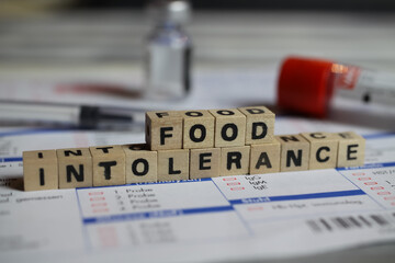 viersen, germany - june 1. 2021: closeup of word food intolerance on laboratory requisition slip wit