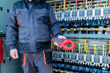 Wall Mural - checking the operating voltage levels of the solar panel switchgear compartment