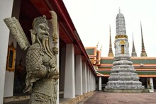 Lan Than Or Rock Giants With Weapons Represent Noble Warriors And Phra Maha Stupa Or Phra Prang In Wat Pho Also Spelled Wat Po, Is A Buddhist Temple In Bangkok, Thailand.