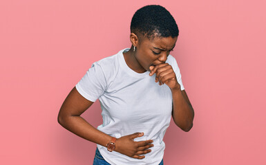 Sticker - Young african american woman wearing casual white t shirt feeling unwell and coughing as symptom for cold or bronchitis. health care concept.