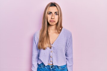 Canvas Print - Beautiful hispanic woman wearing casual shirt depressed and worry for distress, crying angry and afraid. sad expression.