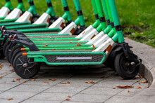 Many Electric Scooters Are Parked On The Street. The Problem Of Accidents And Injuries Caused By Electric Scooters.