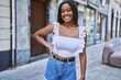 © Krakenimages.com - Young african american girl smiling happy standing at the city.