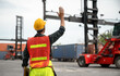 © tool51 - Engineer control loading Container from Cargo freight ship for import and export , support logistics transportation concept.