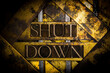 Shut Down text formed with real authentic typeset letters on vintage textured silver grunge copper and gold background