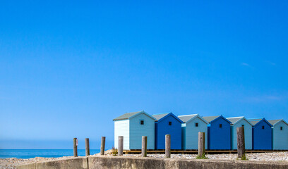 Blue beach houses against the blue sky