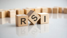 RSI - Relative Strength Index Acronym Concept On Cubes, Gray Background