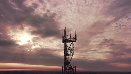 Wall Mural - Telecommunication tower construction with cellular satellite antennae dishes on the epic red sunset sky on background. Innovation wireless broadcast network technology transmit signal by radio wave.